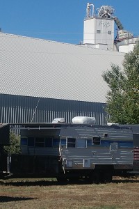 Funky trailer and nearby factory