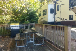 Wooden patio with grill